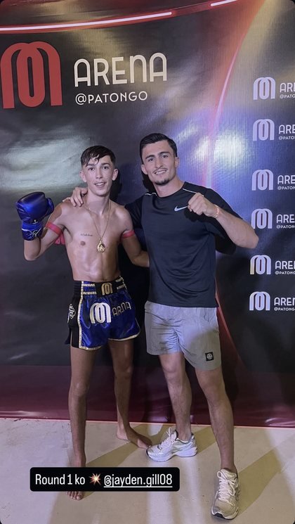 Jayden Gill with his coach after a first-round knockout at M Arena, Phuket