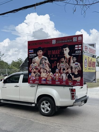 A truck carrying the M Legend Fight poster around Patong with Jayden Gill on it