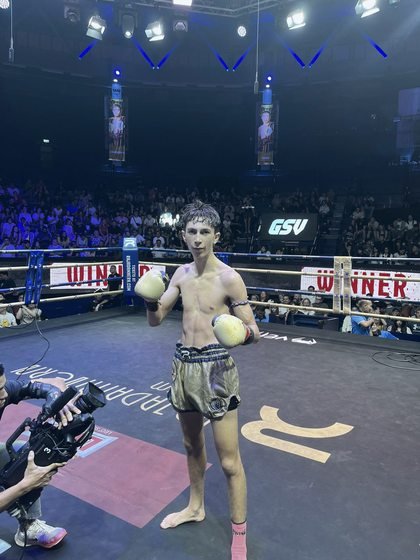 Jayden Gill in the ring at Rajadamnern Stadium, Bangkok, after a win